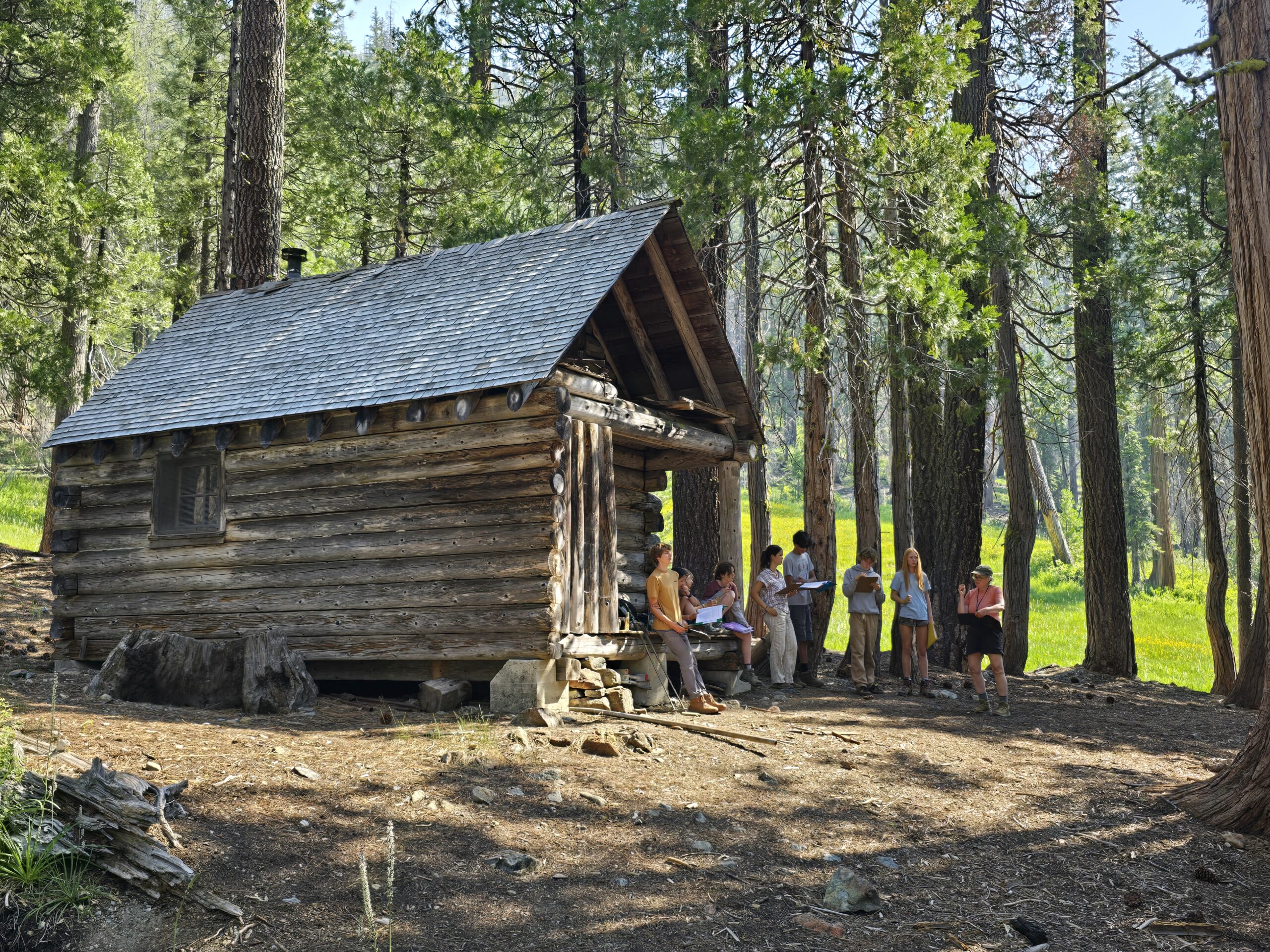 Ascend participants gathered near a backcountry cabin